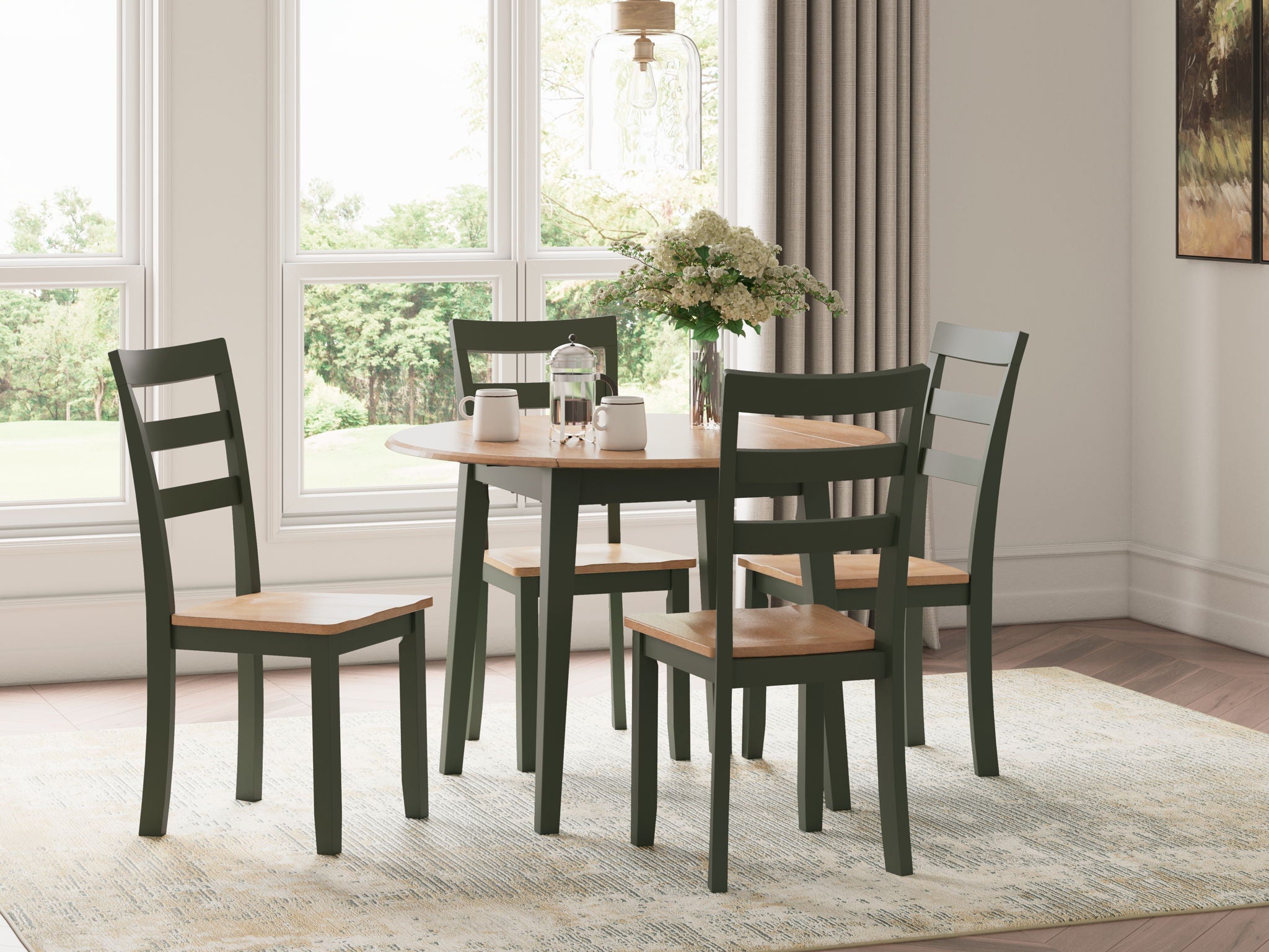 5-piece round dining set with green chairs and round table in a sunlit room