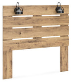 Brown wooden queen panel headboard with two black pendant lights and slat openings