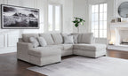 Gray sectional sofa with chaise, four back pillows, low arms, tufted seat cushions
