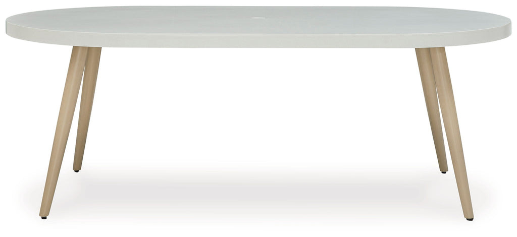 Dining table with light gray round top and light wood legs, side view