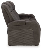 Dark gray upholstered recliner chair with padded armrests and control panel
