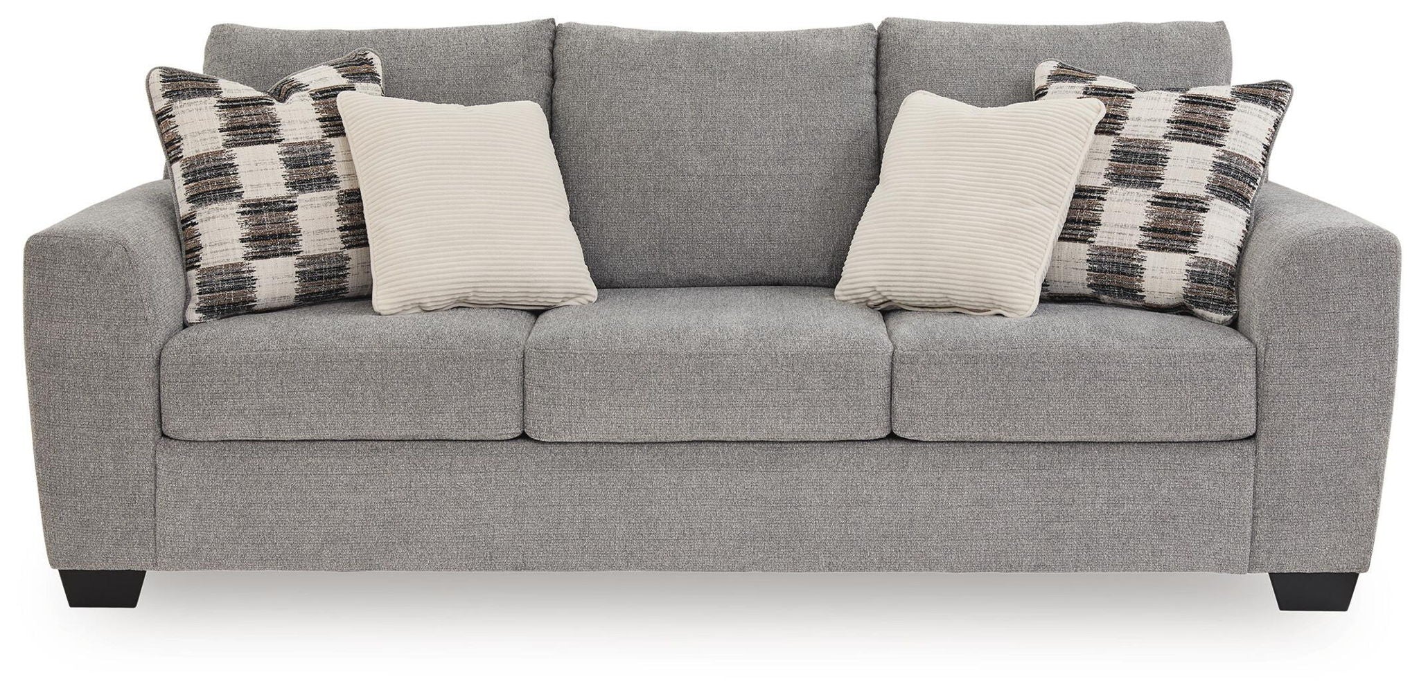 Sofa sleeper, medium gray upholstery with plaid and white throw pillows.