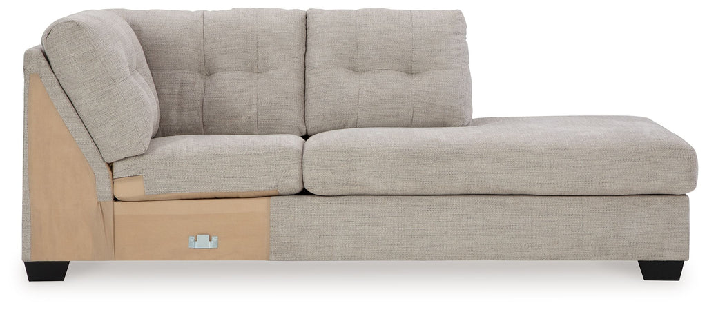Light gray corner chaise with tufted back, track arms, and dark legs