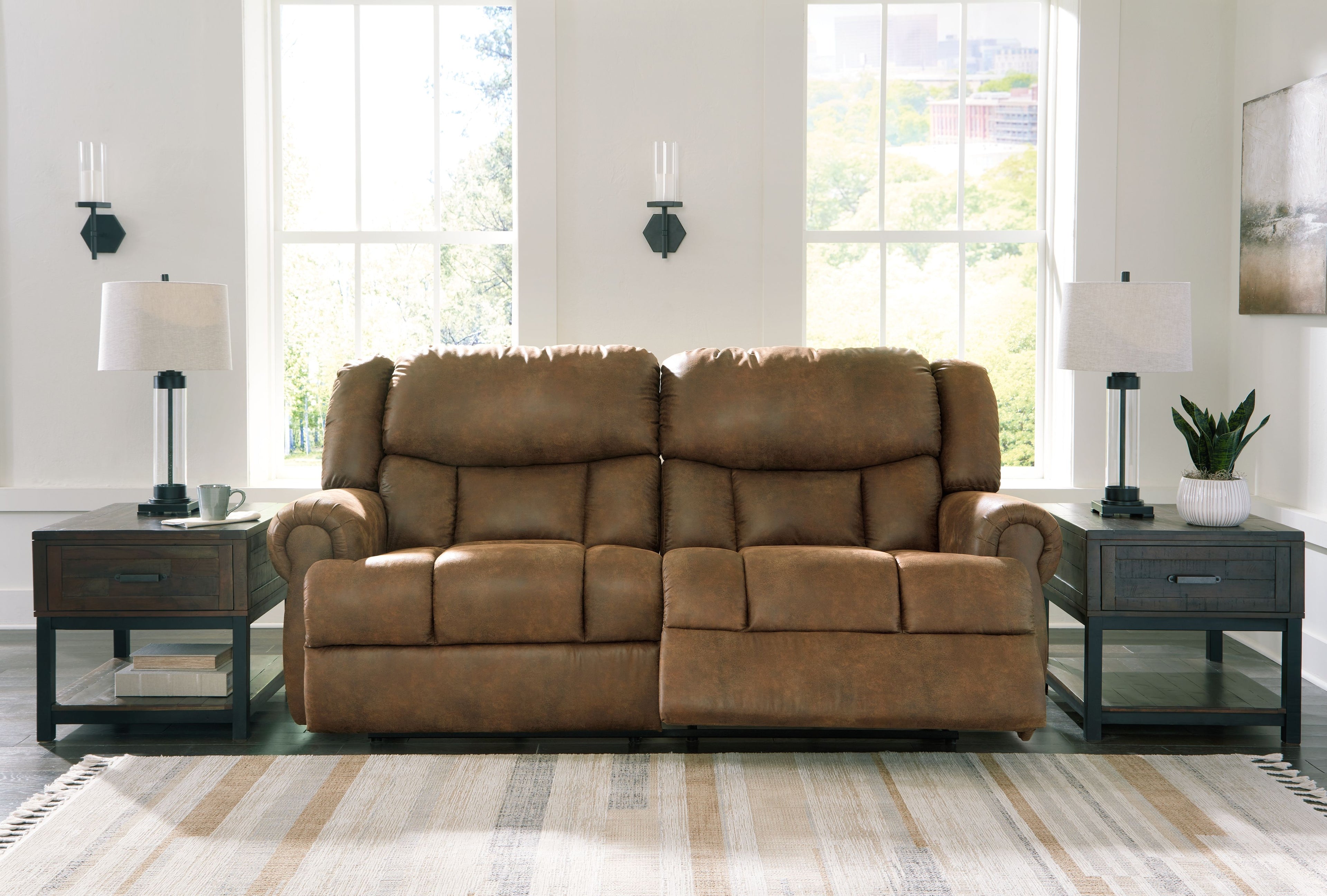 Reclining sofa loveseat with two padded recliner seats, brown upholstery
