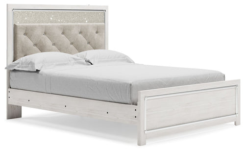 Upholstered panel bed with light gray tufted headboard and white wood frame