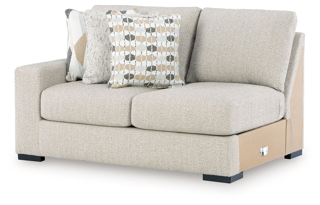 Light beige left-arm loveseat with boxy arms, two cushions, and dark base feet.