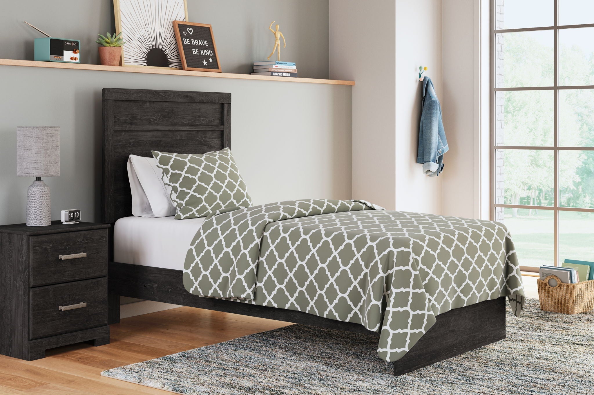 Panel bed with dark wood headboard and footboard, patterned duvet and pillows