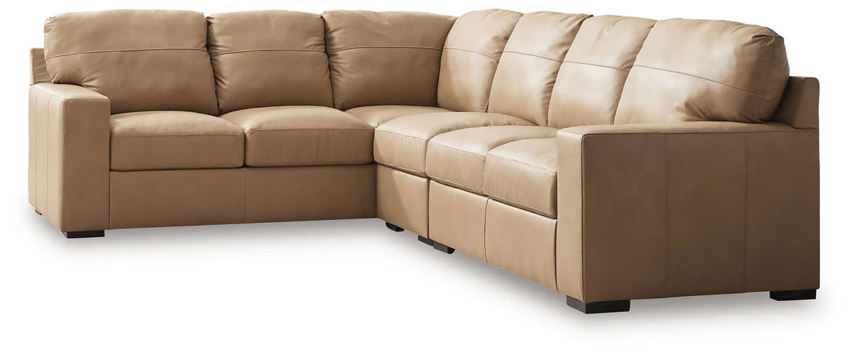 Two-tone sectional sofa with chaise section and tufted back cushions in tan and cream