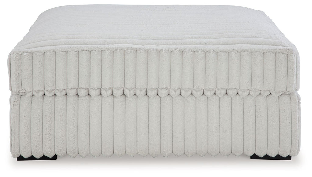 Oversized accent ottoman, light gray ribbed fabric with flat top and side trim