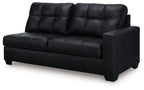 Dark two-seat sofa with tufted back panels, wide seat cushions, and block legs