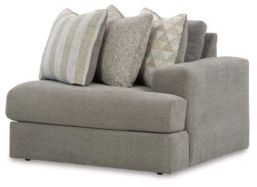 Ash gray corner chair with wide arms and four accent throw pillows
