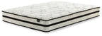 White hybrid mattress with dark edge trim and quilted top surface