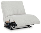 Light gray armless recliner chair with ribbed upholstery and extended leg rest