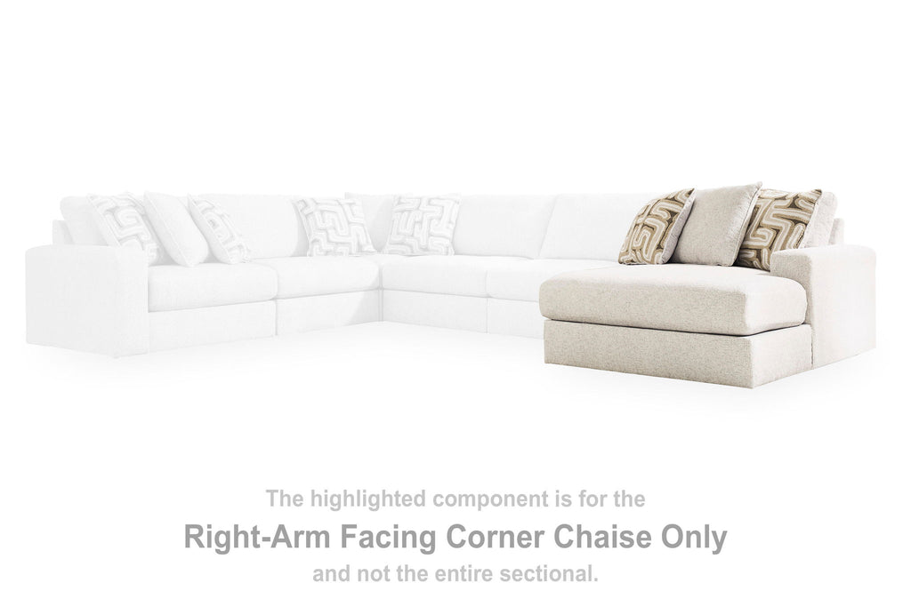 Light beige corner chaise with patterned pillows, viewed in sectional layout