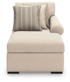 Beige corner chaise lounge with back cushion and striped throw pillows, square arms