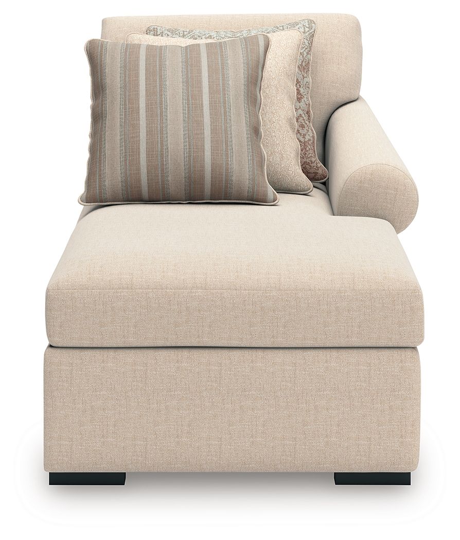 Beige corner chaise lounge with back cushion and striped throw pillows, square arms