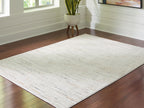 Light beige rug with distressed linear texture and flat weave finish