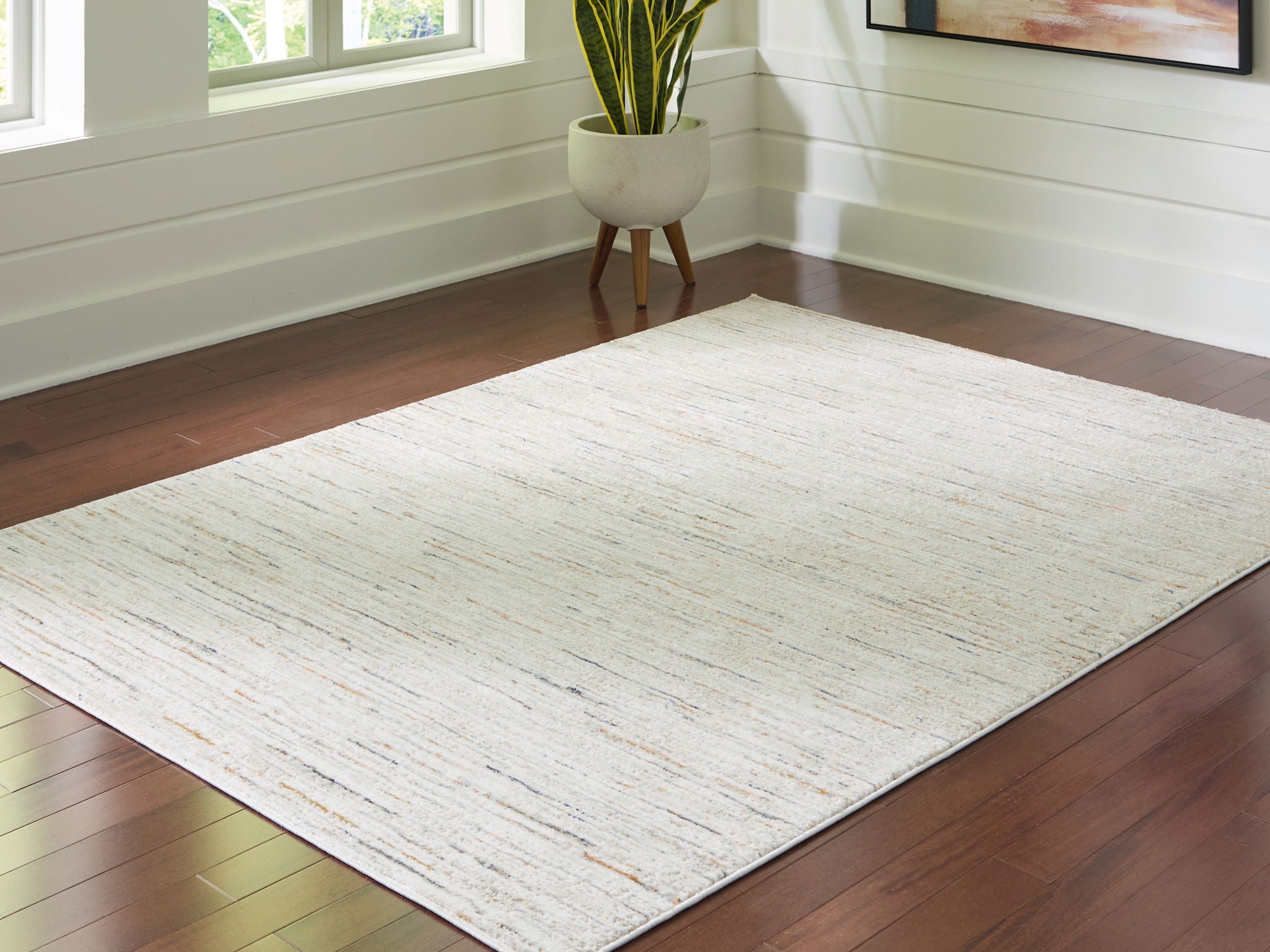 Light beige rug with distressed linear texture and flat weave finish