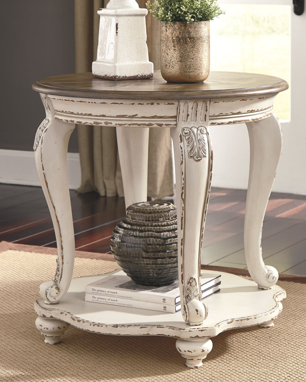Round end table with dark-brown top and distressed white finish