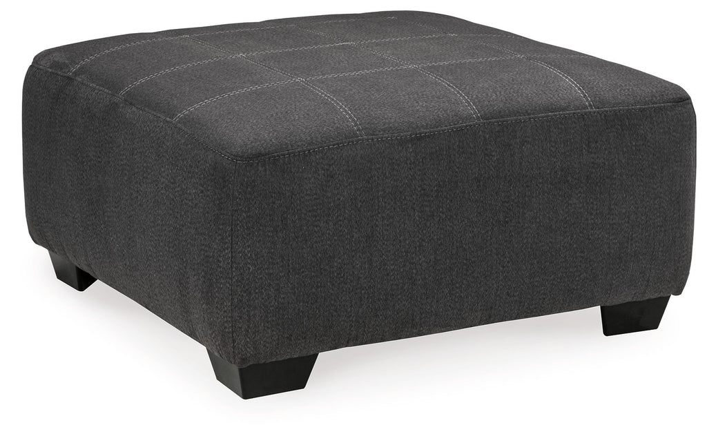 Slate gray oversized accent ottoman with rounded corners and tufted lid