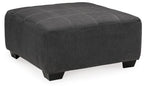 Slate gray oversized accent ottoman with rounded corners and tufted lid