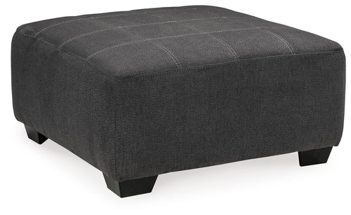 Slate gray oversized accent ottoman with rounded corners and tufted lid