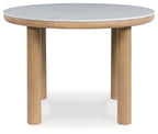Light brown round dining table with light gray marble-look top and four tapered legs
