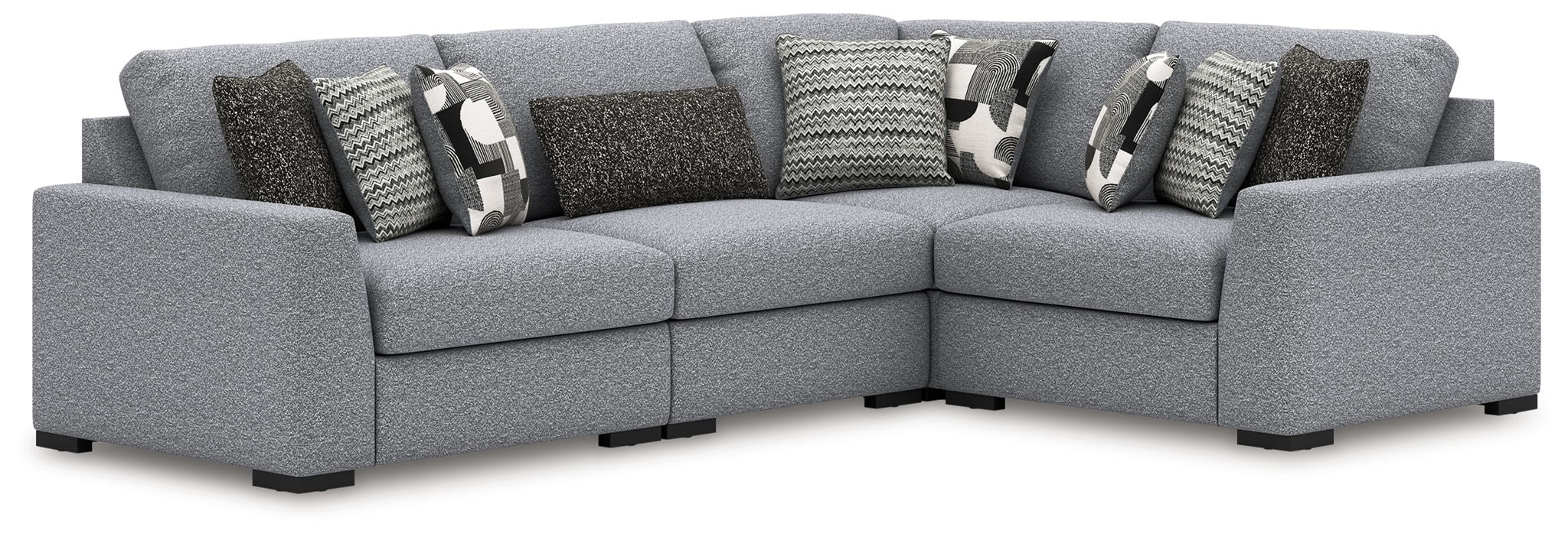Gray fabric sectional sofa with corner chaise and multiple patterned accent pillows