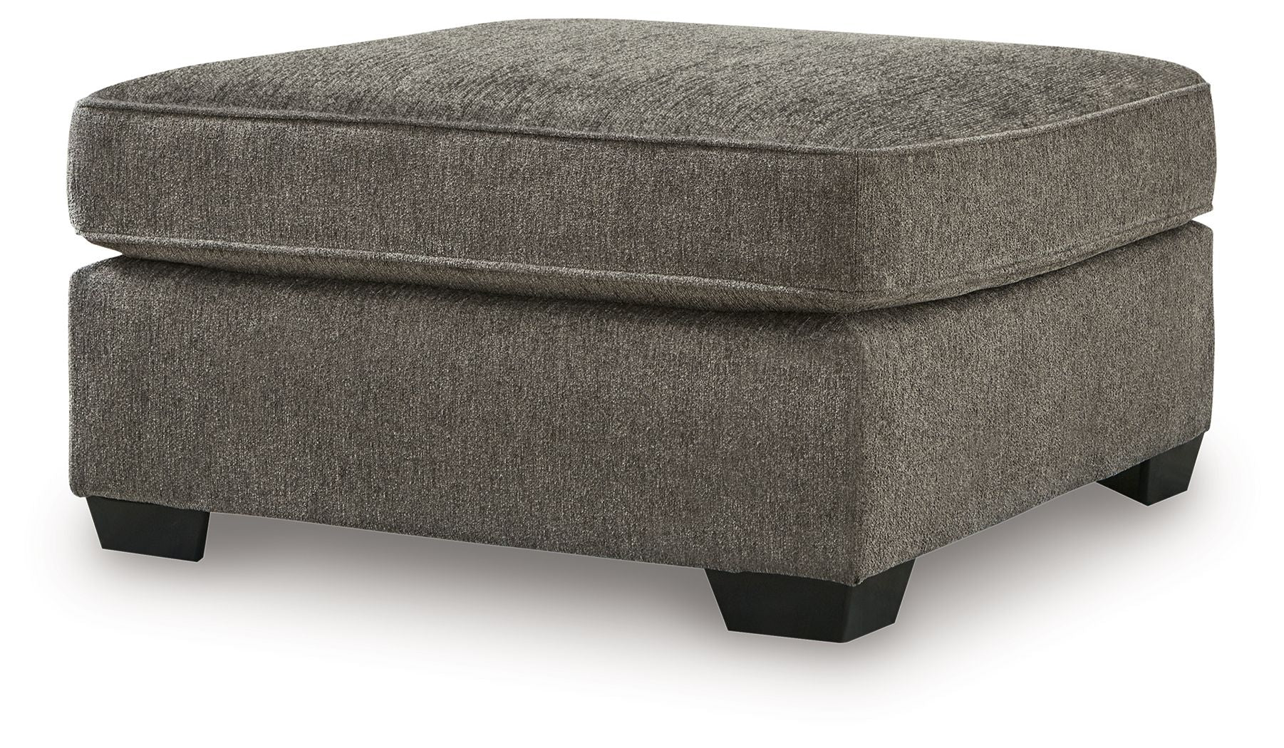 Dark gray ottoman with padded lid, rounded edges, and dark block legs