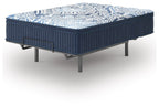 Blue mattress with patterned top, ribbed sides, and metal side handle