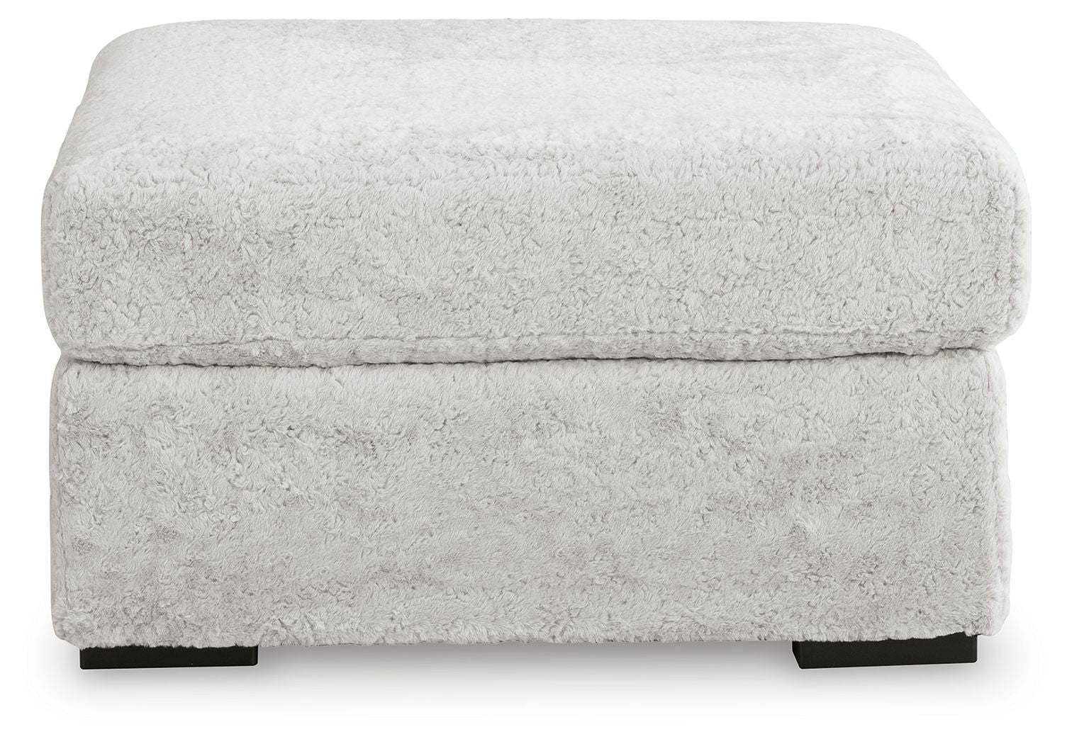 Light gray oversized accent ottoman with textured upholstery and padded lid