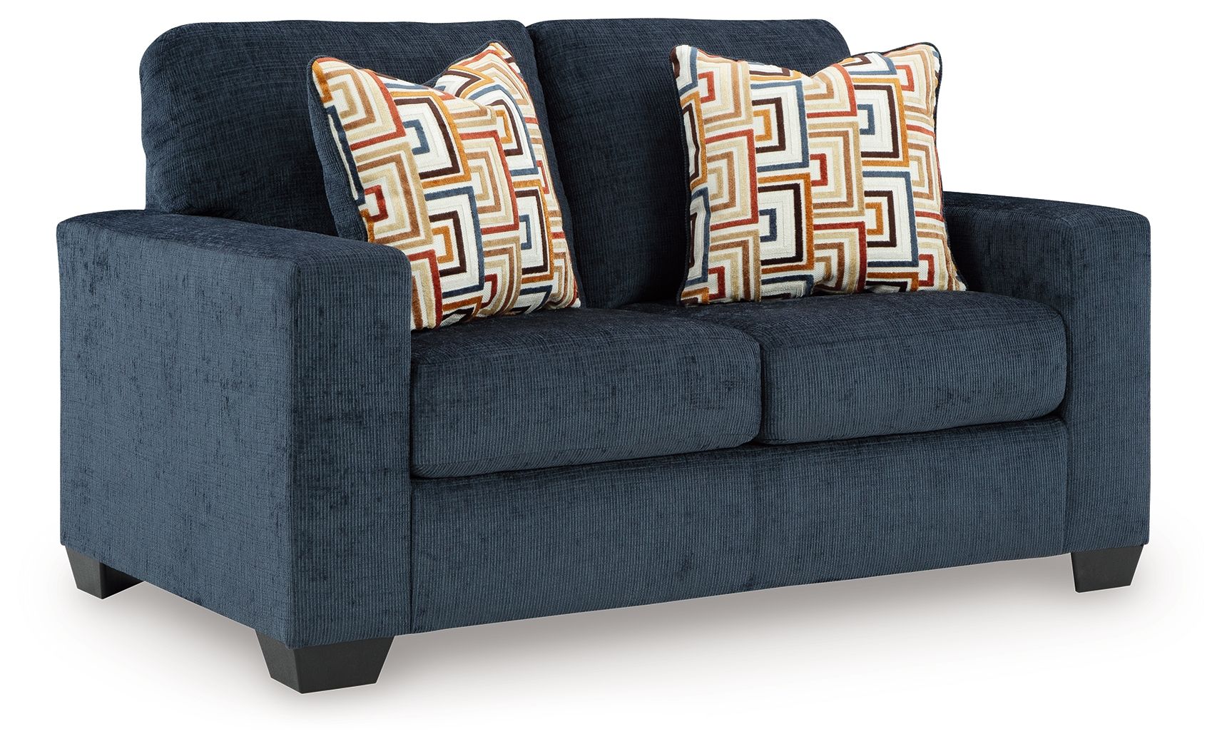 Dark navy loveseat with two decorative patterned throw pillows and boxy seat front.