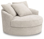 Swivel accent chair with rounded arms and boucle-style upholstery, light beige.