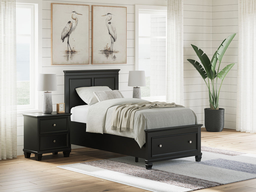 Black panel bed with paneled headboard and two drawers; white bedding in bedroom