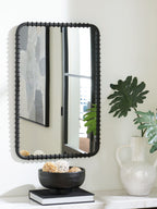 Black accent mirror with arched corners and decorative beaded trim