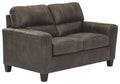 Smoke gray loveseat with padded arms and tufted backrest, square arms and tapered legs