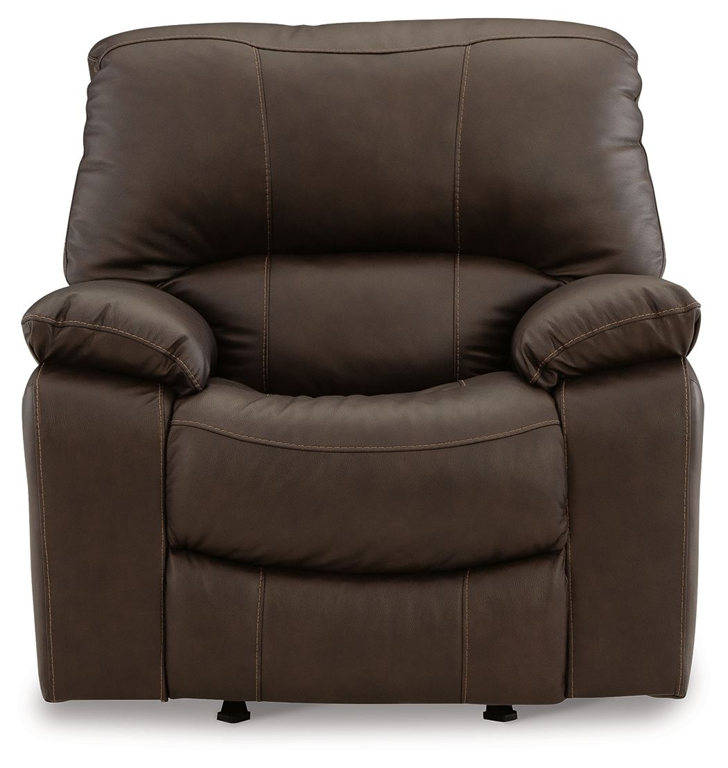 Dark brown rocker recliner chair with padded back and armrests, rolled cushions