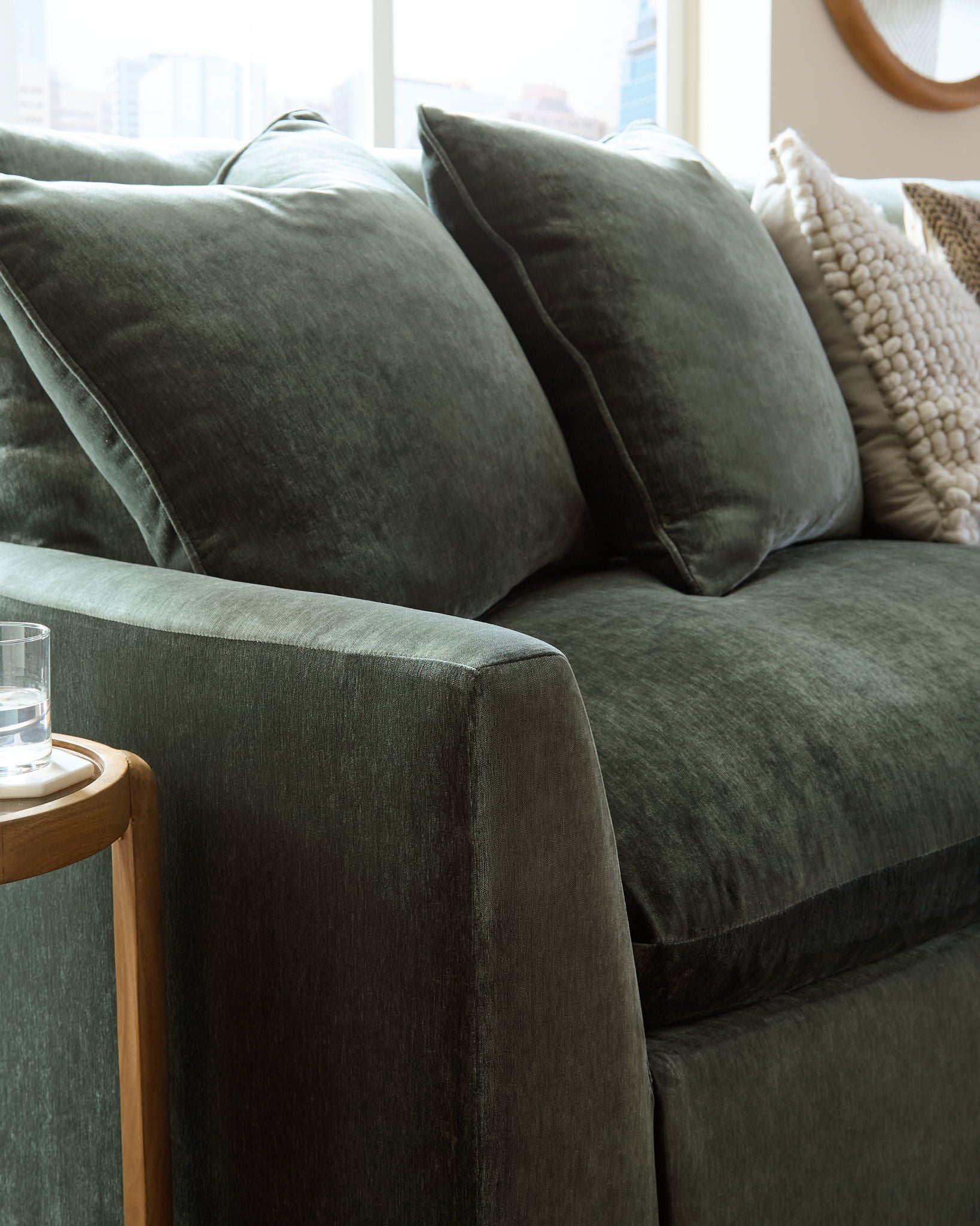 Jade green sectional sofa arm and seat cushion with textured fabric
