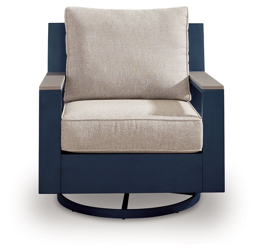 Swivel glider chair with cushion, blue body and beige seat with square back pillow