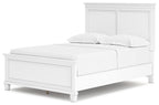 White panel bed with paneled headboard and one side view, two cushions on top.