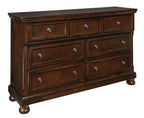 Porter dresser in rustic brown with multiple drawers and round metal knobs
