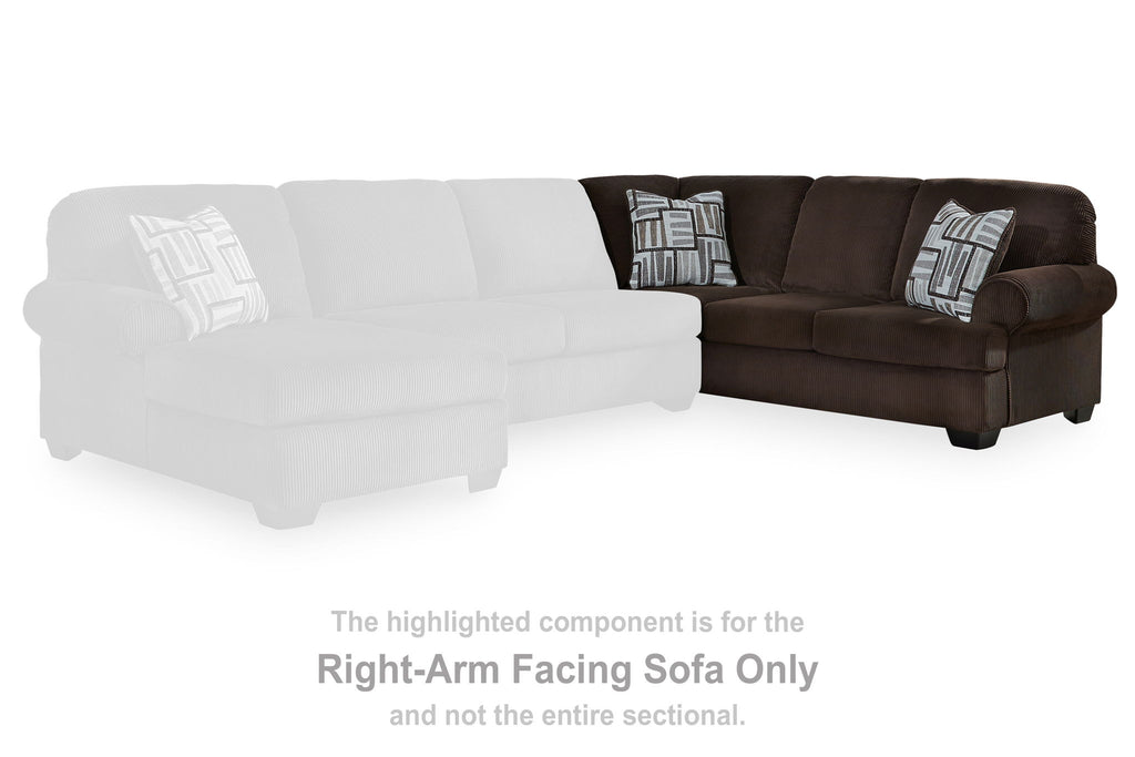 Right-arm facing chocolate-brown sectional sofa with three seat cushions and two throw pillows