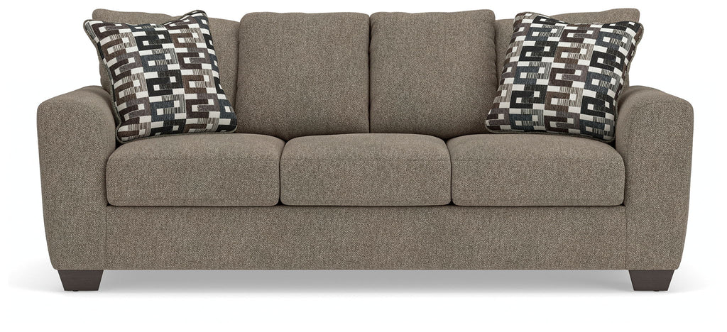 Gray queen sofa sleeper with three seat cushions and two patterned back pillows