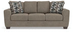 Gray queen sofa sleeper with three seat cushions and two patterned back pillows