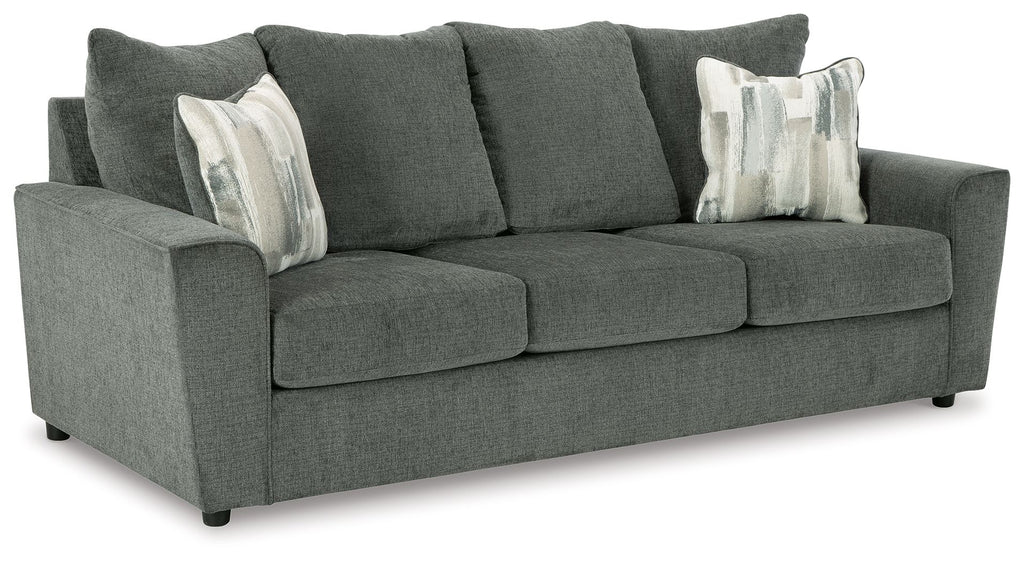 Stairatt sofa front view with three seat cushions, tall back, and white patterned throw pillows