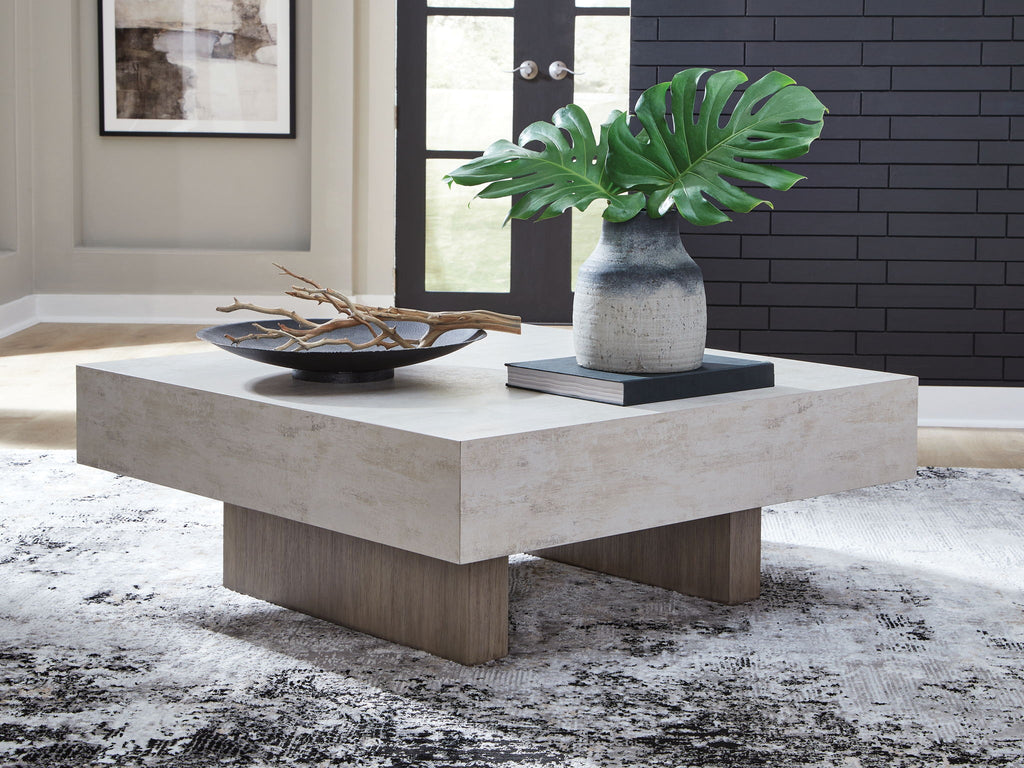 Rectangular table with light concrete top and light wood base, squared legs