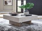 Rectangular table with light concrete top and light wood base, squared legs