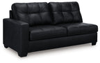 Dark carbon sofa with tufted back, rolled arms, and two-seat design