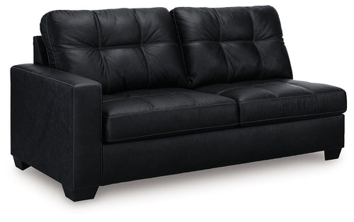 Dark carbon sofa with tufted back, rolled arms, and two-seat design