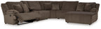 Dark brown reclining sectional sofa with chaise extension and cushioned arms